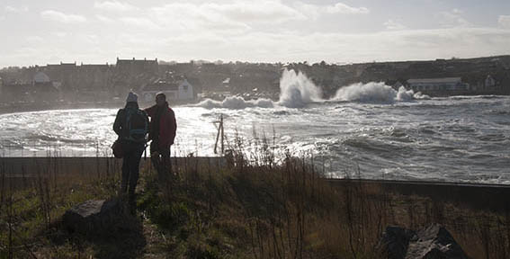 Eyemouth Waves behind Dave and Jo